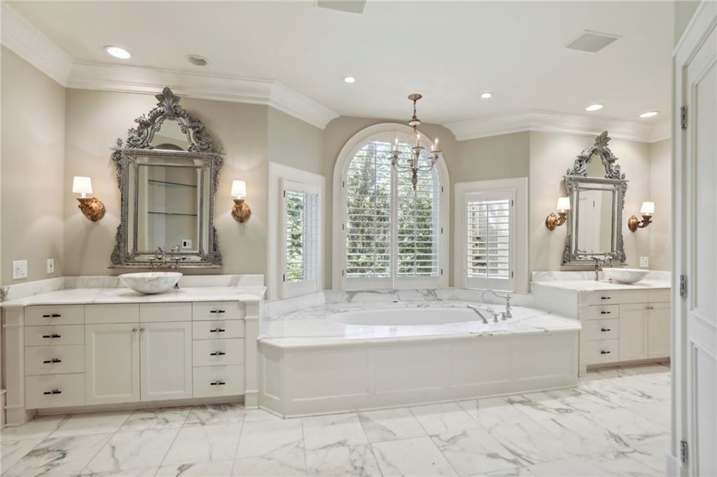 1965 West Wesley Road Northwest Atlanta, GA 30327 - Photo 31 of 34 a spacious bathroom with a large tub sink and double vanity