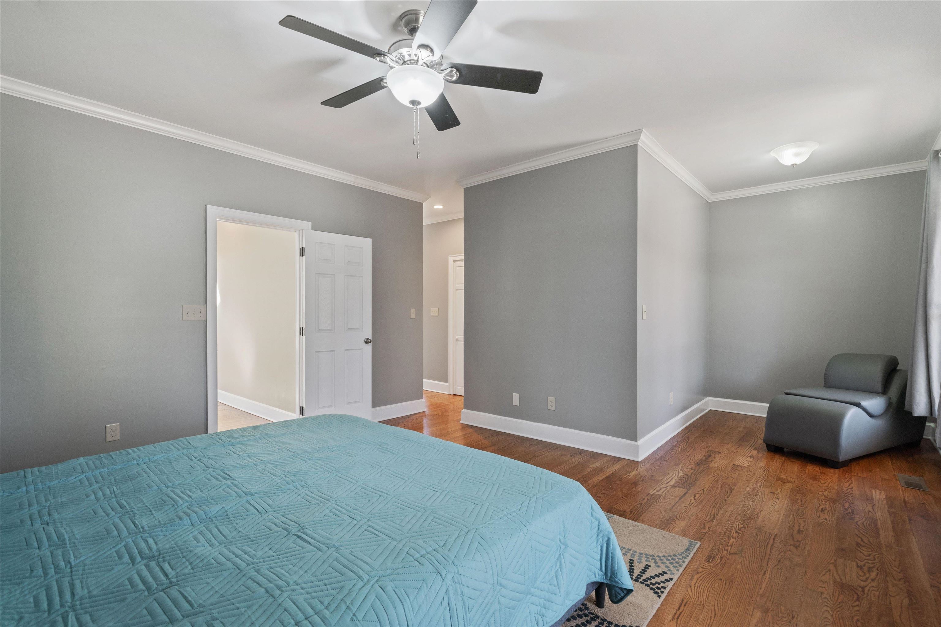 1805 Russell Road Bolivar, TN 38008 - Photo 13 of 39 Bedroom with ornamental molding, ceiling fan, baseboards, and wood finished floors