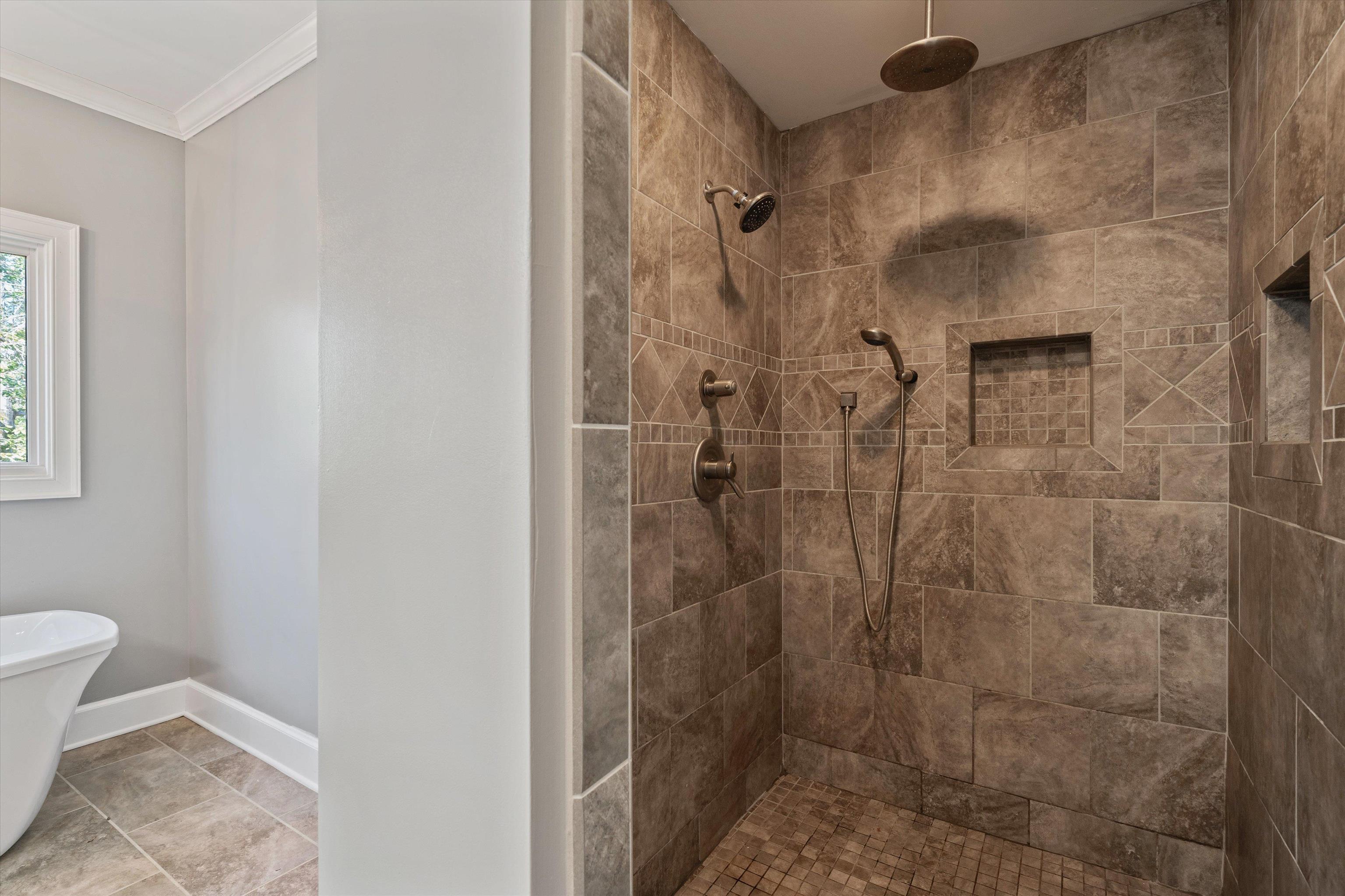 1805 Russell Road Bolivar, TN 38008 - Photo 15 of 39 Bathroom with ornamental molding, a tile shower, and baseboards
