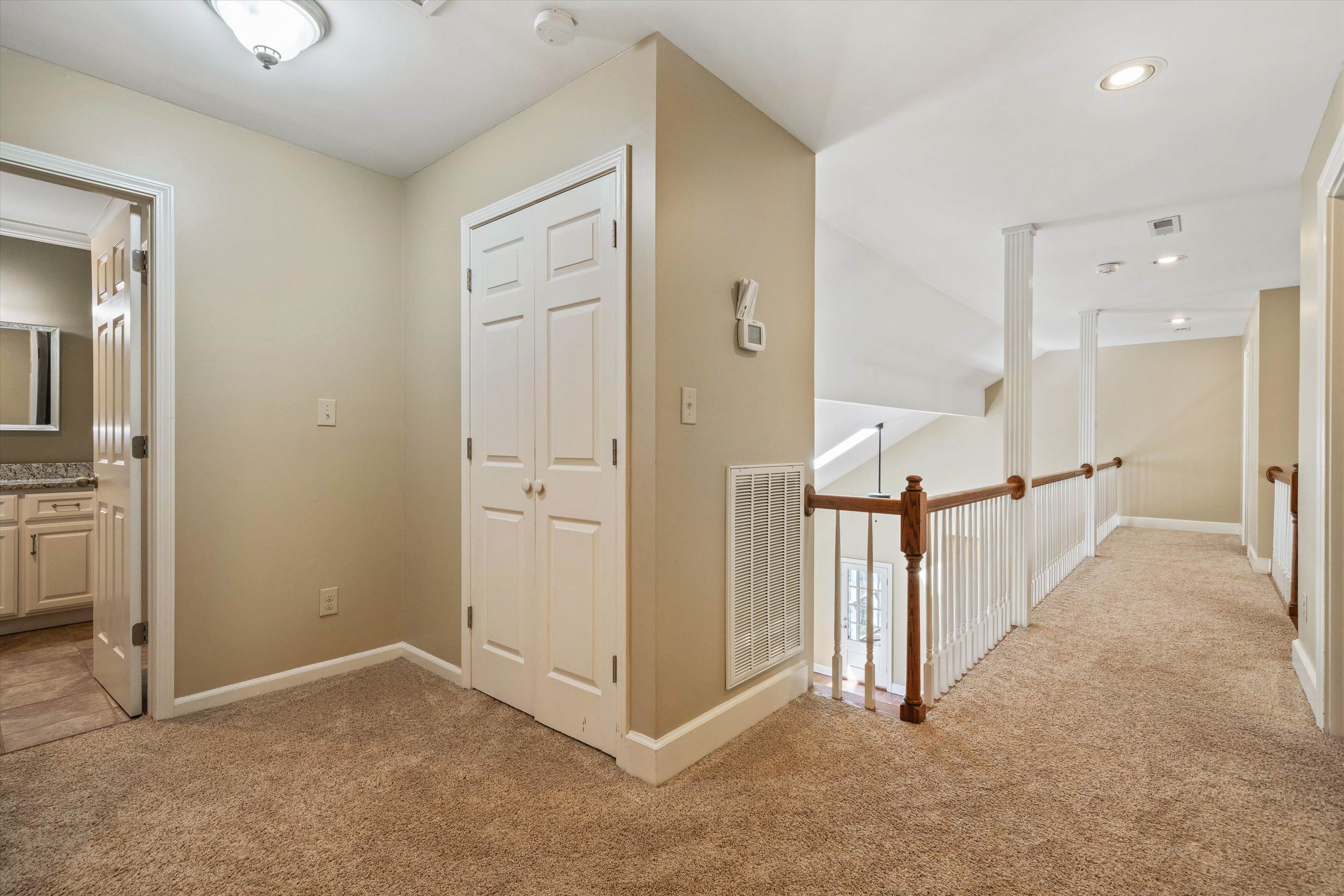 1805 Russell Road Bolivar, TN 38008 - Photo 18 of 39 Hall featuring recessed lighting, baseboards, visible vents, and light colored carpet