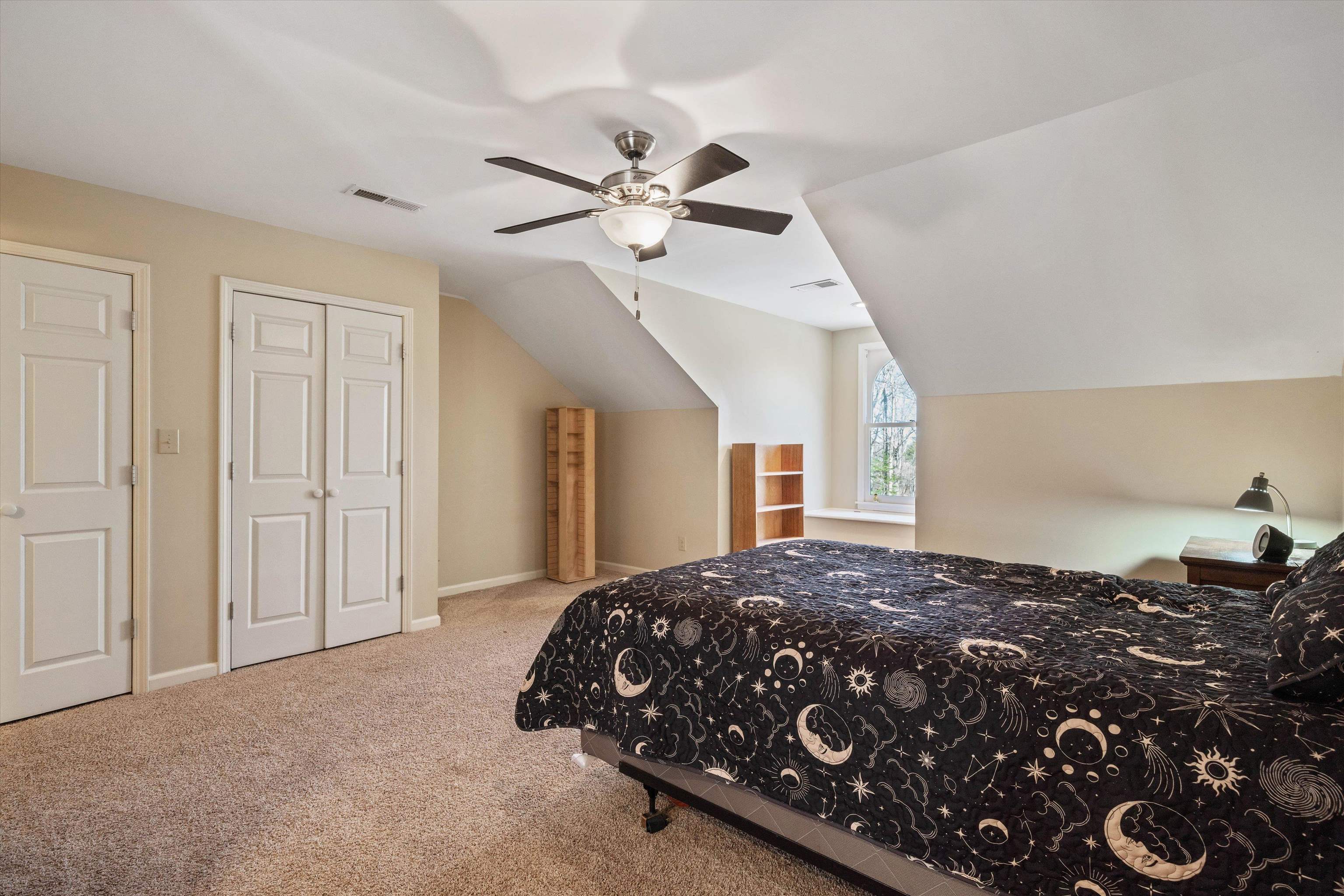 1805 Russell Road Bolivar, TN 38008 - Photo 19 of 39 Carpeted bedroom featuring visible vents, vaulted ceiling, baseboards, and ceiling fan