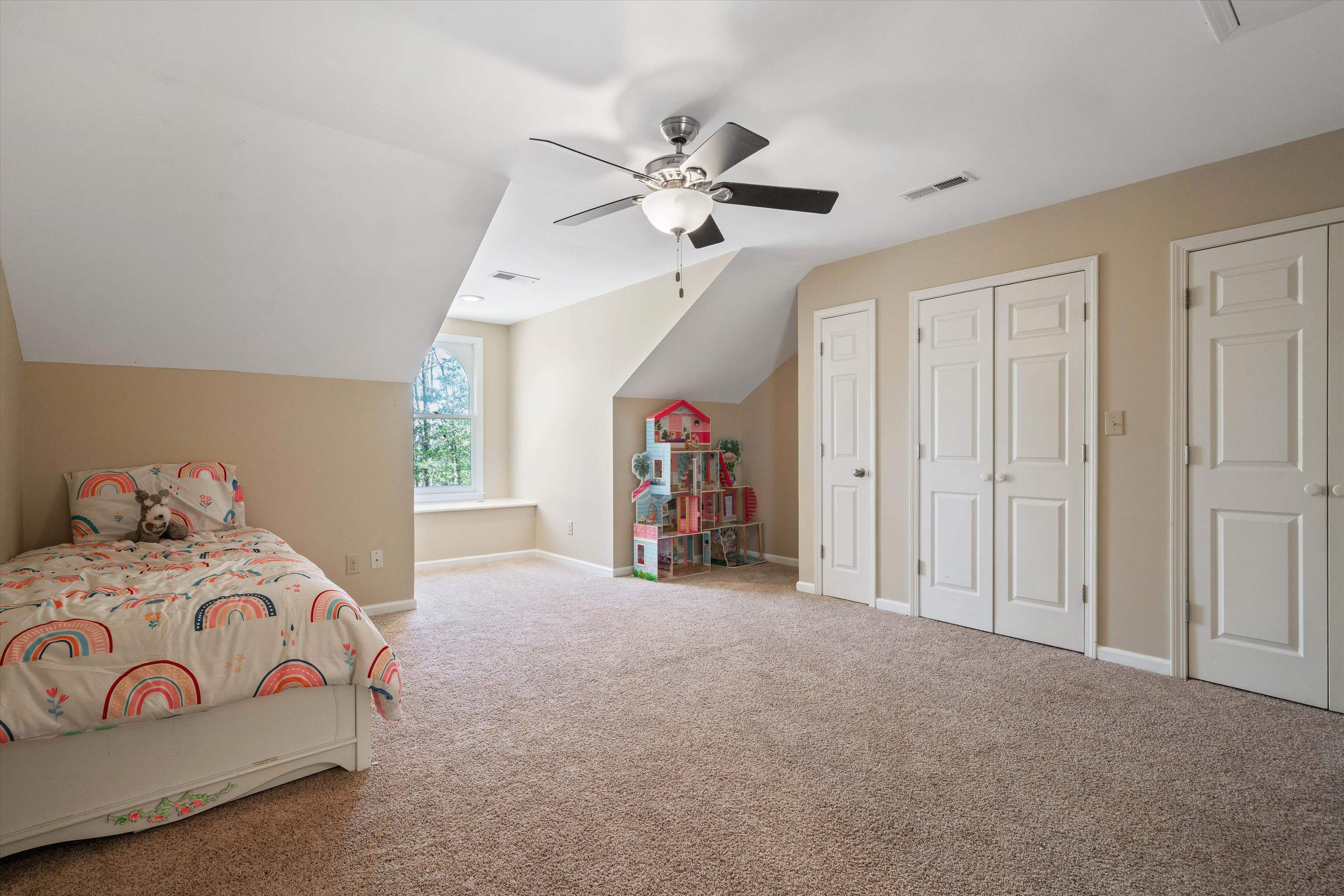1805 Russell Road Bolivar, TN 38008 - Photo 23 of 39 Carpeted bedroom with lofted ceiling, a ceiling fan, visible vents, and baseboards
