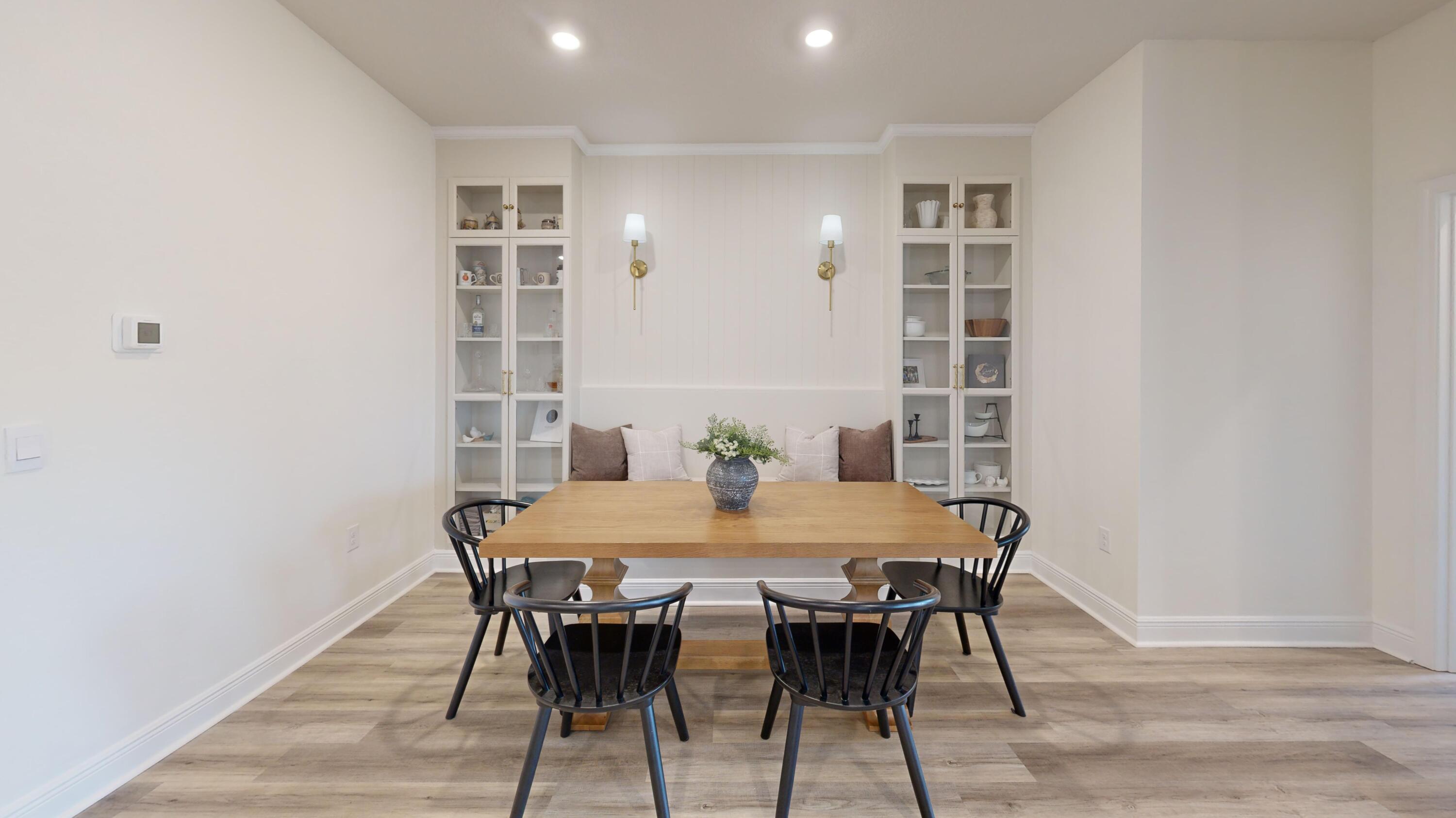 8130 Fir Tree Drive Milton, FL 32583 - Photo 14 of 17 a view of a dining room with furniture and wooden floor