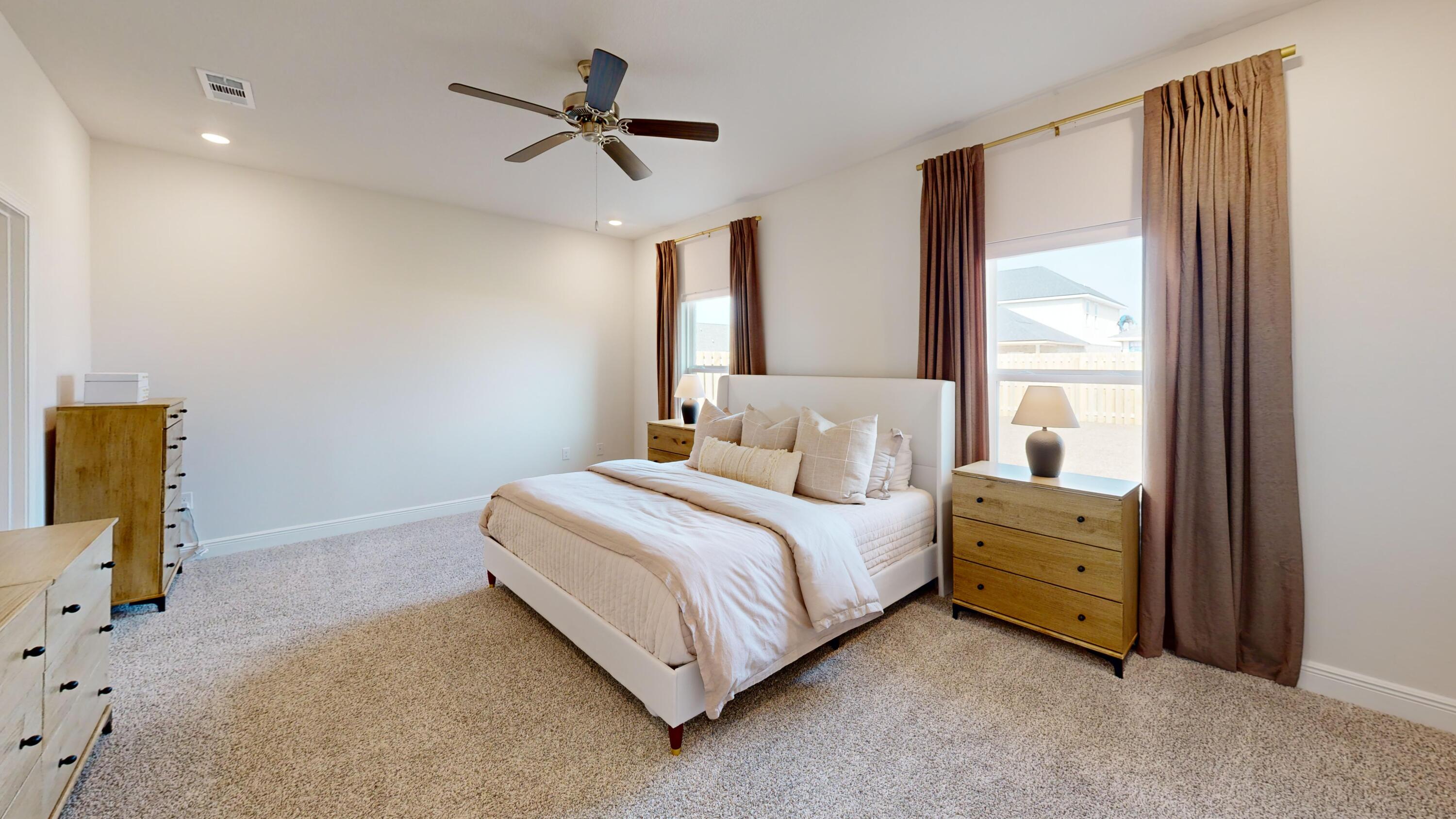 8130 Fir Tree Drive Milton, FL 32583 - Photo 7 of 17 a bedroom with a bed and a window