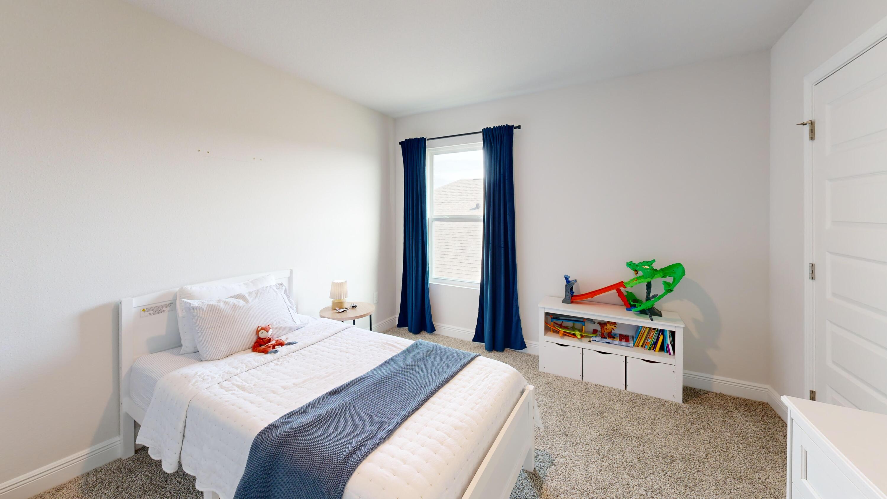 8130 Fir Tree Drive Milton, FL 32583 - Photo 10 of 17 a bed room with a bed and a chair