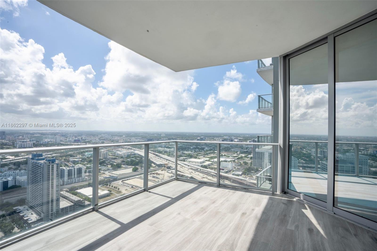 Park West Miami, FL 33132 - Photo 1 of 20 a view of a balcony with wooden floor