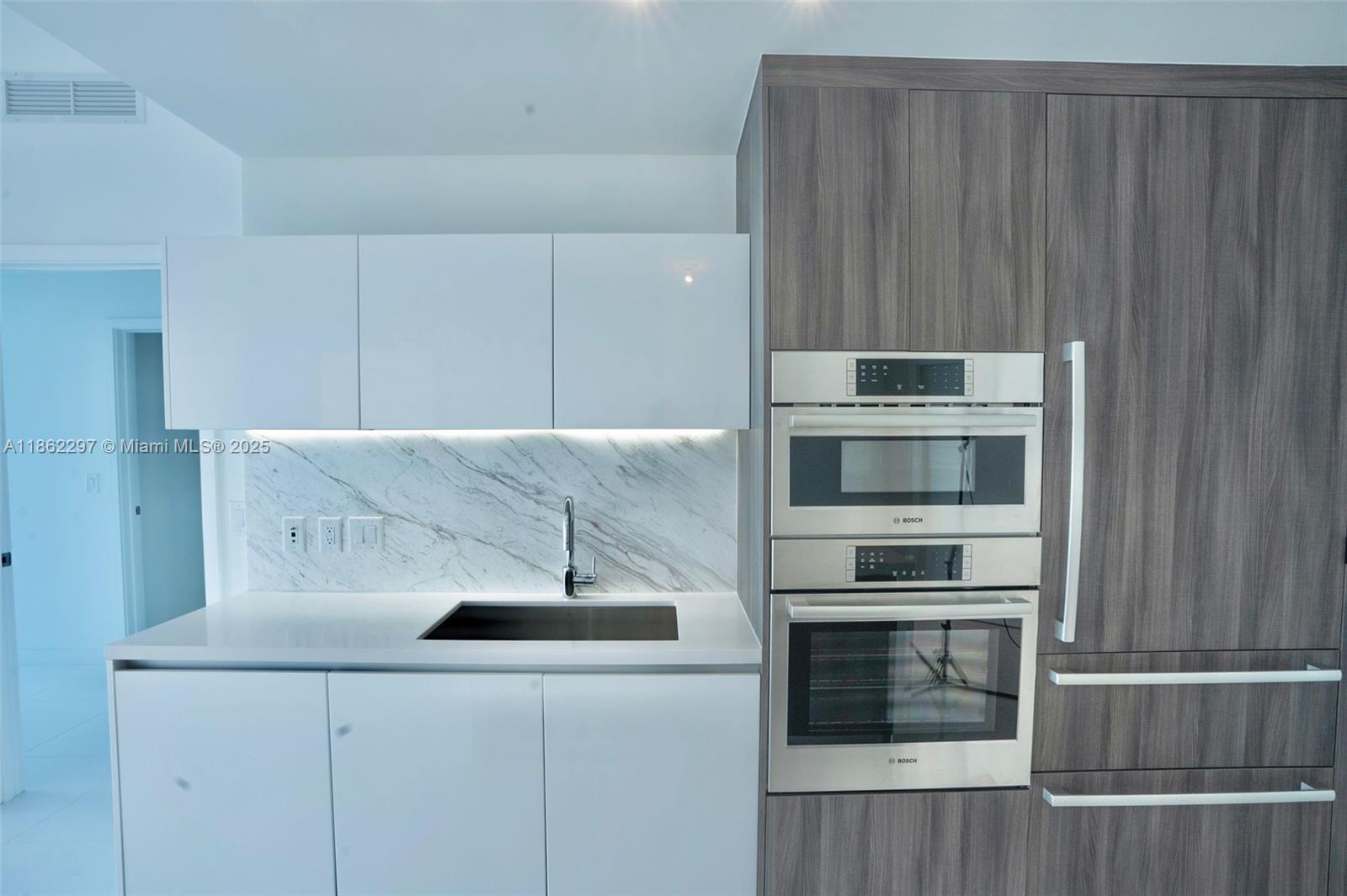 Park West Miami, FL 33132 - Photo 5 of 20 a kitchen with a sink and an oven