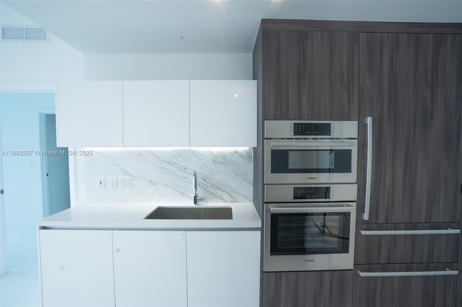 Park West Miami, FL 33132 - Photo 6 of 20 a kitchen with a stove and a microwave