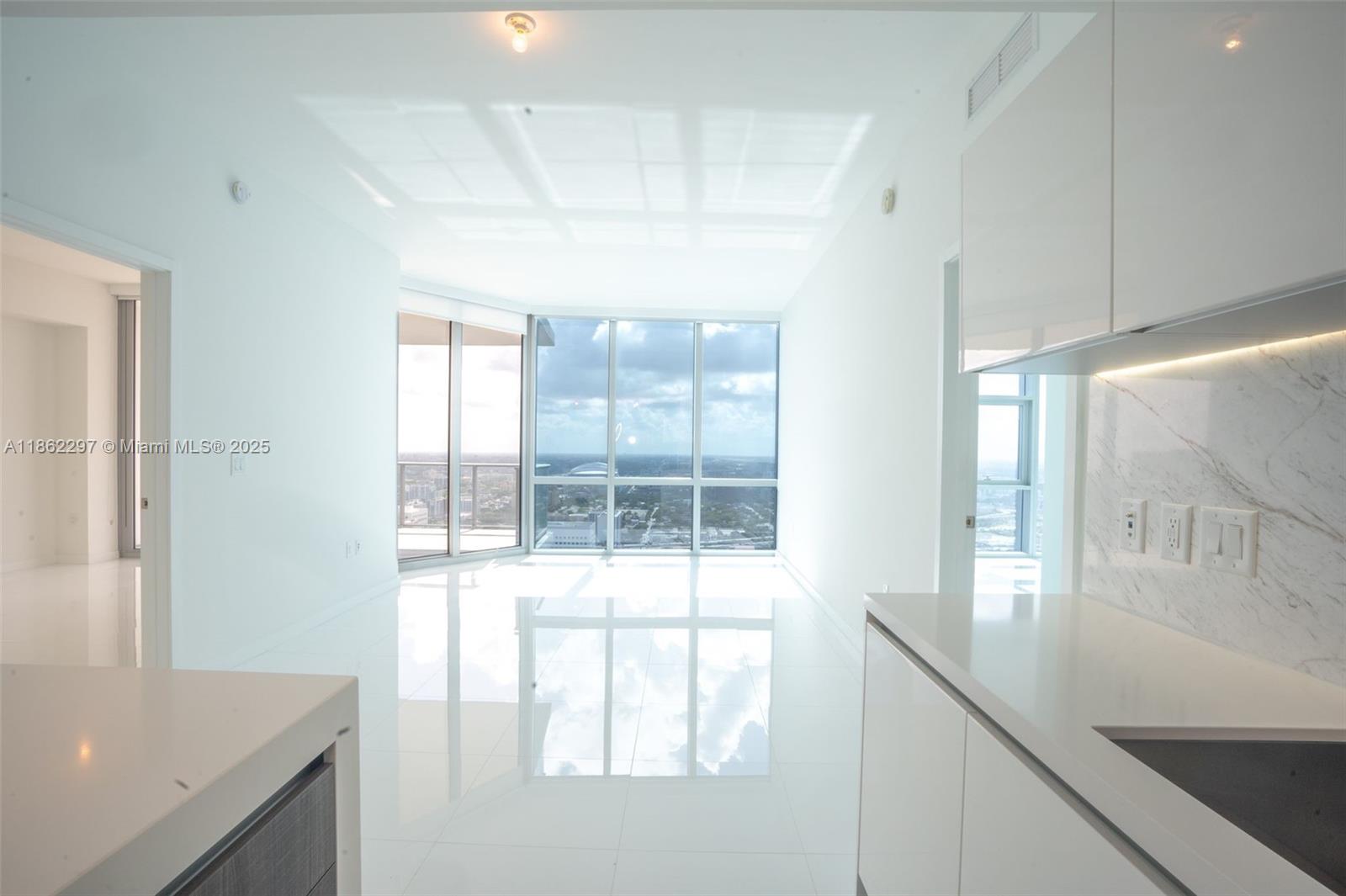 Park West Miami, FL 33132 - Photo 7 of 20 a view of a kitchen with a sink and a window
