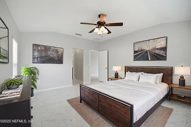 a spacious bathroom with a double vanity sink mirror and shower