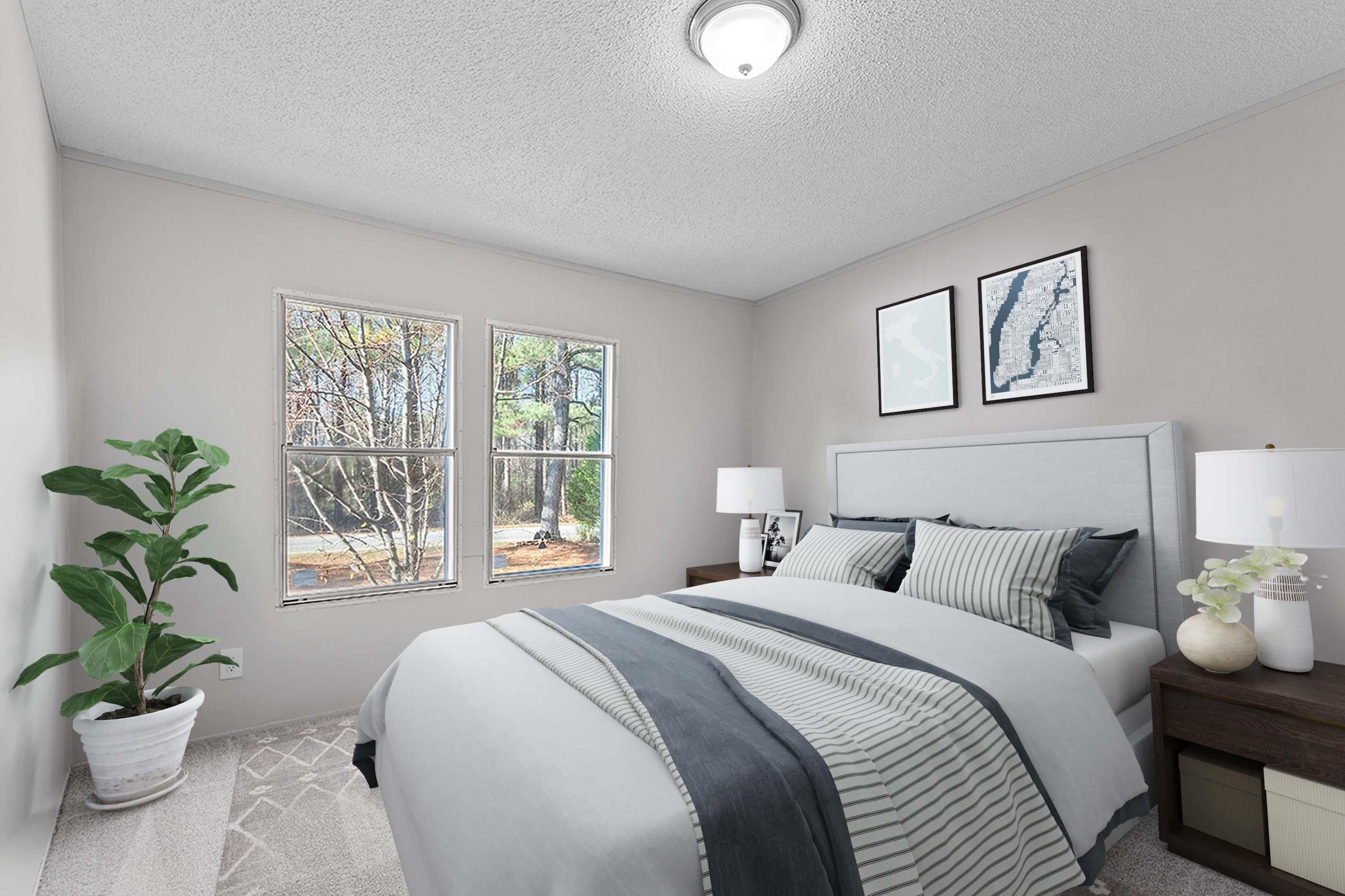8401 South Creek Road Willow Spring, NC 27592 - Photo 7 of 24 a bedroom with a bed and a potted plant