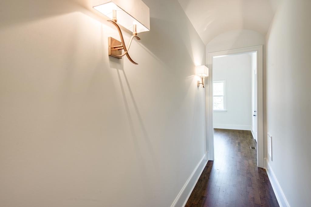 5622 Valley View Road Brentwood, TN 37027 - Photo 16 of 28 a view of a hallway with wooden floor