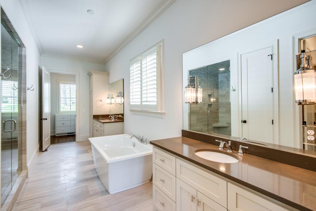 5622 Valley View Road Brentwood, TN 37027 - Photo 17 of 28 a spacious bathroom with a shower sink and mirror