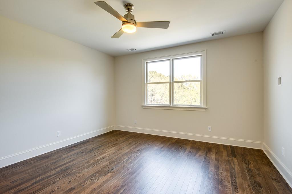 5622 Valley View Road Brentwood, TN 37027 - Photo 23 of 28 an empty room with wooden floor and windows