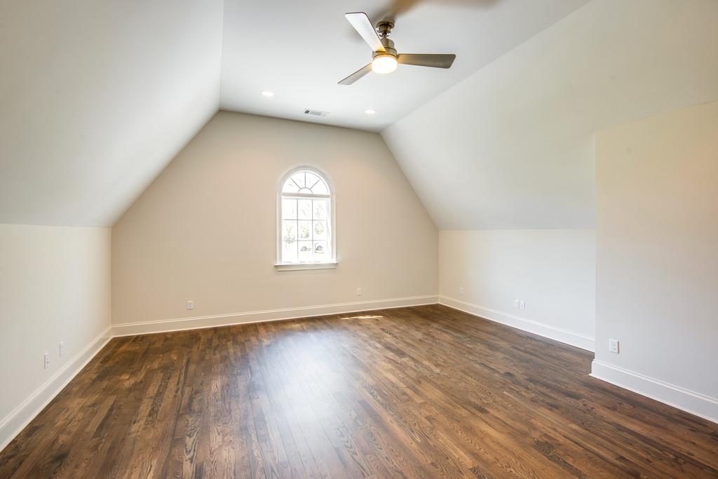 5622 Valley View Road Brentwood, TN 37027 - Photo 24 of 28 an empty room with wooden floor and windows