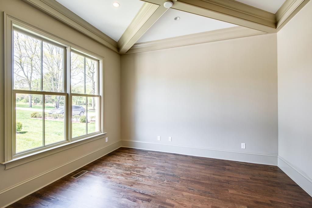 5622 Valley View Road Brentwood, TN 37027 - Photo 4 of 28 a view of an empty room with wooden floor and a window