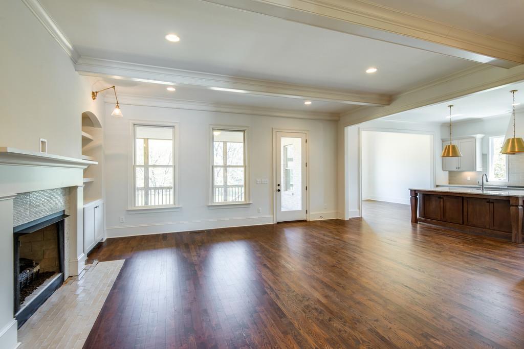 5622 Valley View Road Brentwood, TN 37027 - Photo 6 of 28 an empty room with wooden floor fireplace and windows