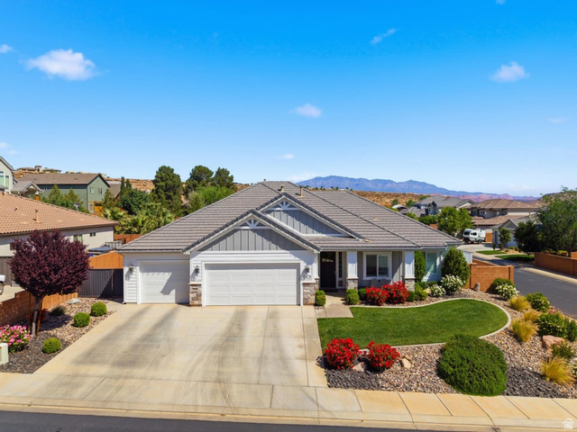 2829 East 1880th Street South St. George, UT 84790 - Photo 2 of 54 Craftsman-style house featuring an attached garage, stone siding, board and batten siding, a residential view, and driveway