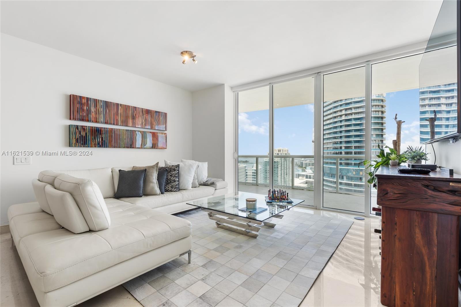 450 Alton Road, Unit 3106 Miami Beach, FL 33139 - Photo 14 of 40 a living room with furniture and floor to ceiling windows