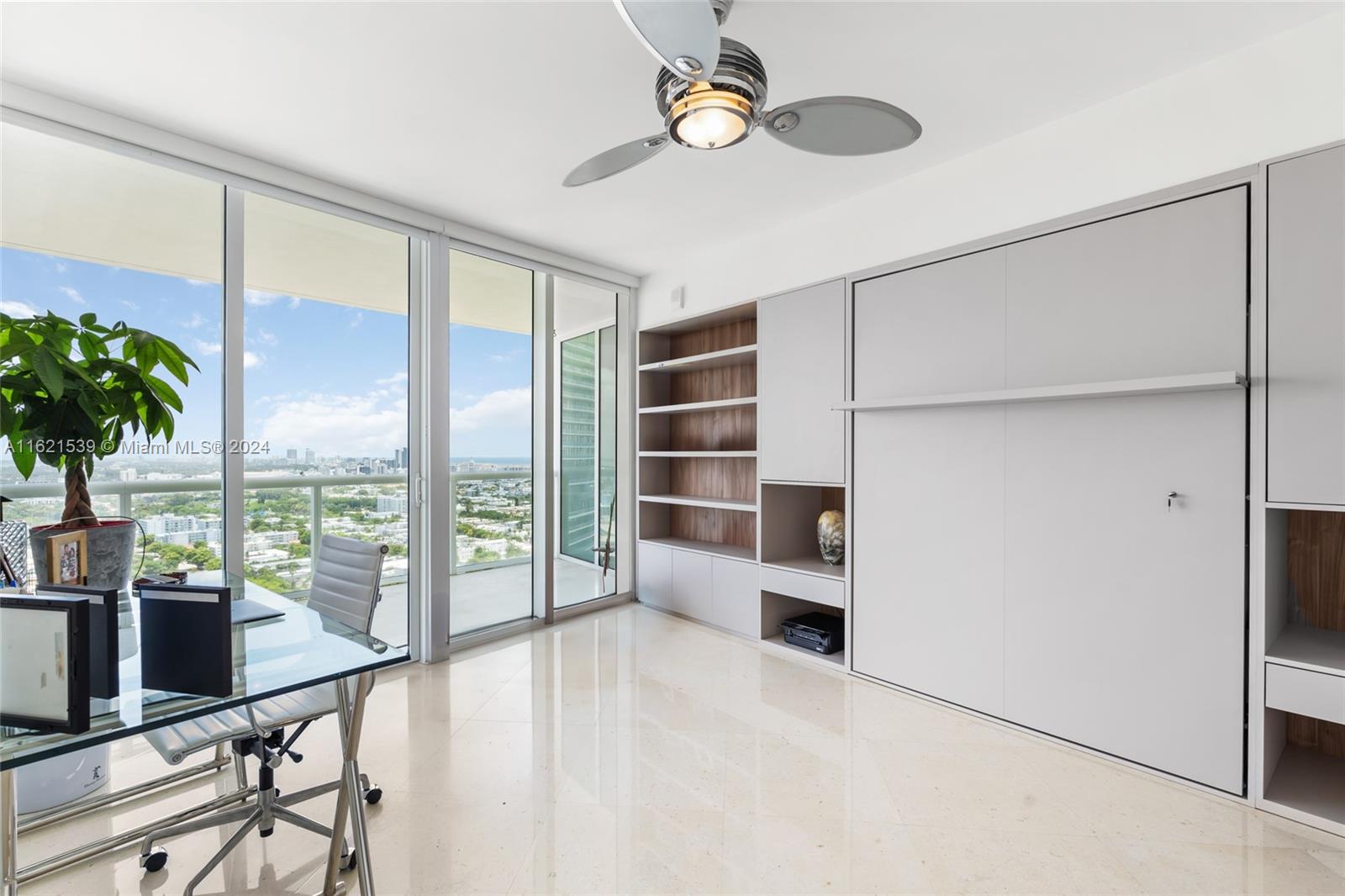 450 Alton Road, Unit 3106 Miami Beach, FL 33139 - Photo 17 of 40 a view of a room with furniture and a large window