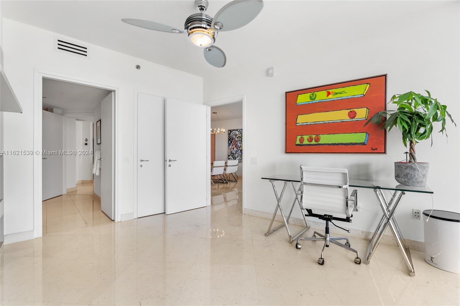450 Alton Road, Unit 3106 Miami Beach, FL 33139 - Photo 18 of 40 a view of a livingroom with furniture and a ceiling fan