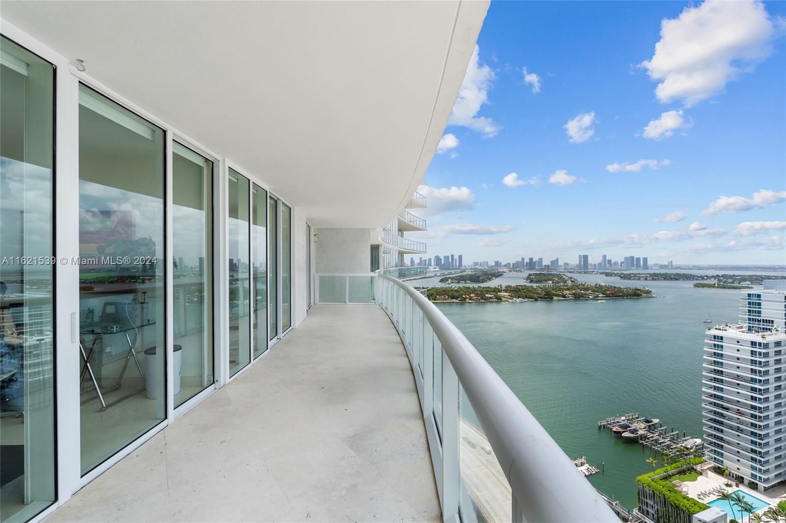 450 Alton Road, Unit 3106 Miami Beach, FL 33139 - Photo 30 of 40 a view of a balcony with lake view and a floor to ceiling window
