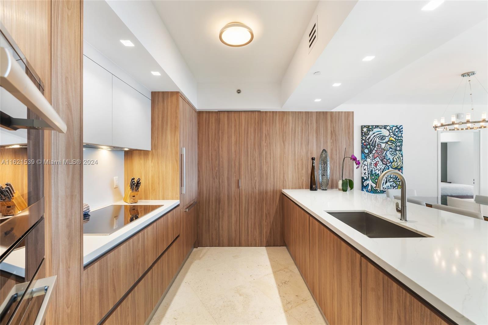 450 Alton Road, Unit 3106 Miami Beach, FL 33139 - Photo 3 of 40 a large kitchen with a sink and large window
