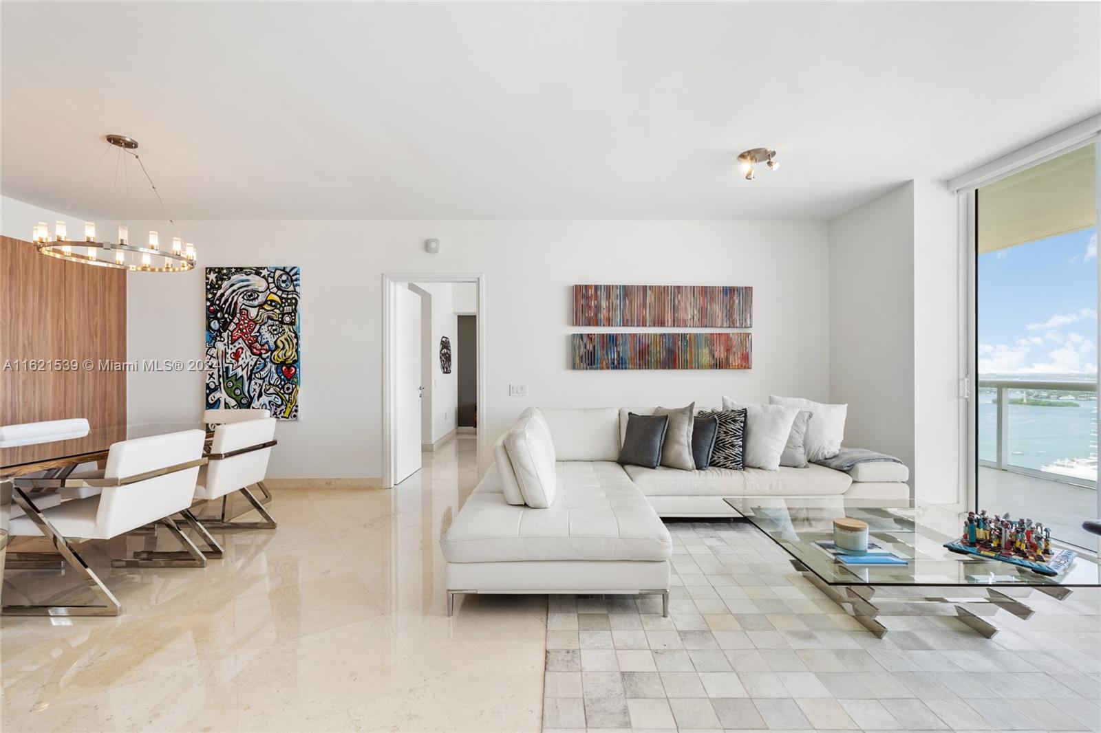 450 Alton Road, Unit 3106 Miami Beach, FL 33139 - Photo 9 of 40 a living room with furniture and a large window