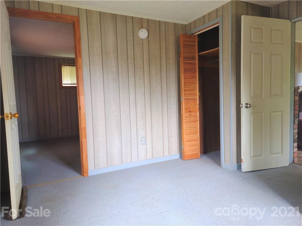 1731 Chambers Mountain Road Clyde, NC 28721 - Photo 23 of 37 an empty room with windows and closet