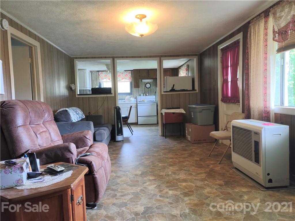 1731 Chambers Mountain Road Clyde, NC 28721 - Photo 24 of 37 a living room with furniture and a window