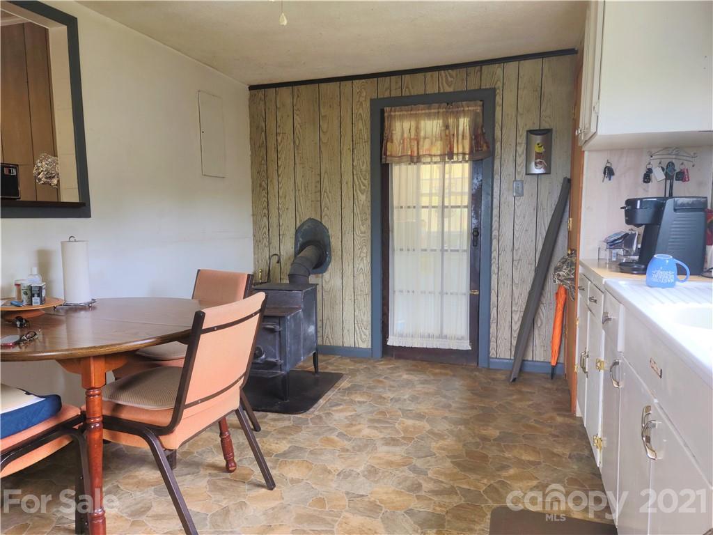 1731 Chambers Mountain Road Clyde, NC 28721 - Photo 27 of 37 a view of a workspace with furniture and a window
