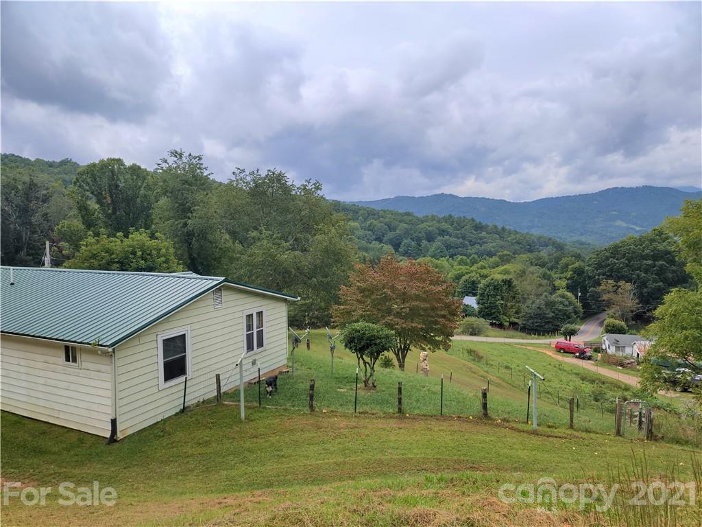 1731 Chambers Mountain Road Clyde, NC 28721 - Photo 34 of 37 a front view of a house with a yard