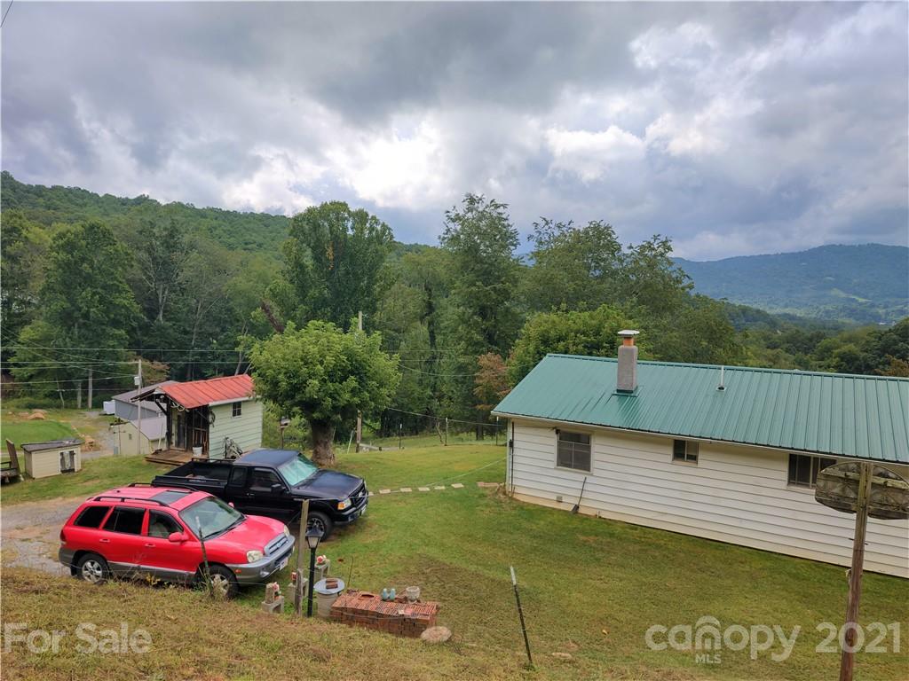 1731 Chambers Mountain Road Clyde, NC 28721 - Photo 35 of 37 a front view of a house with a garden