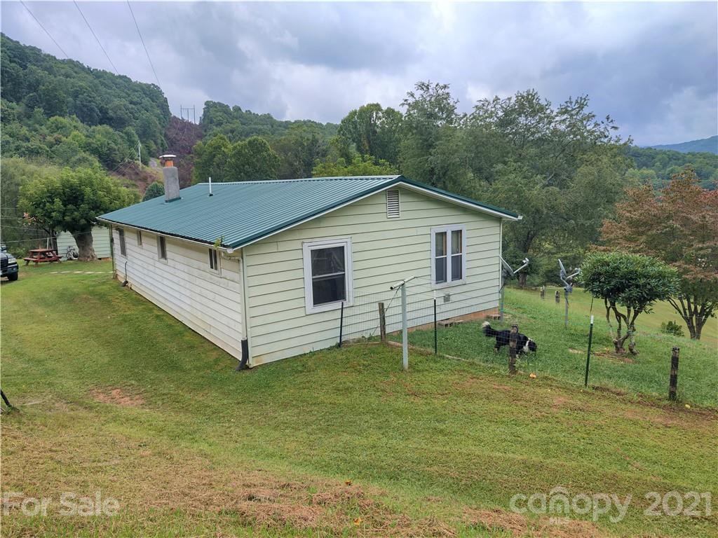 1731 Chambers Mountain Road Clyde, NC 28721 - Photo 36 of 37 a view of a house with a yard