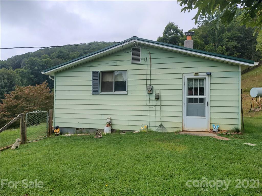 1731 Chambers Mountain Road Clyde, NC 28721 - Photo 5 of 37 a front view of a house with a yard