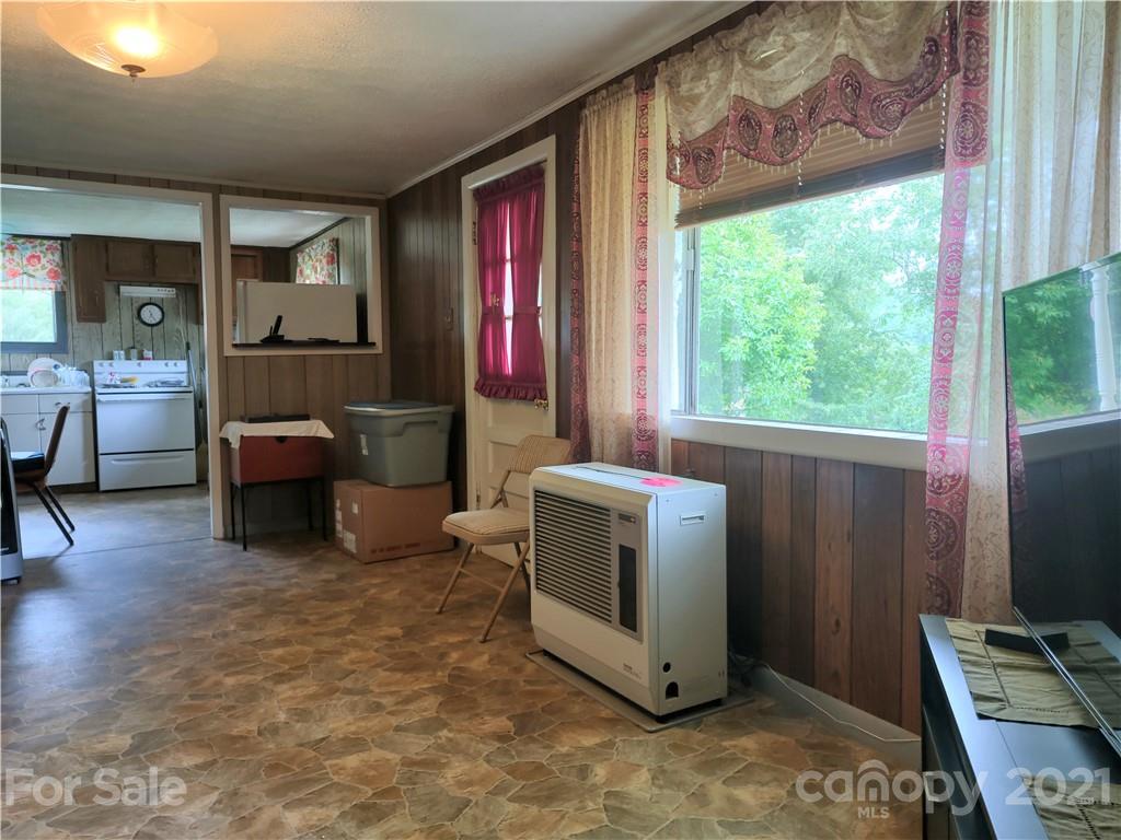 1731 Chambers Mountain Road Clyde, NC 28721 - Photo 9 of 37 a room with furniture and a window