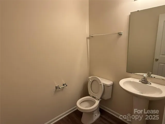 a bathroom with a toilet and a sink