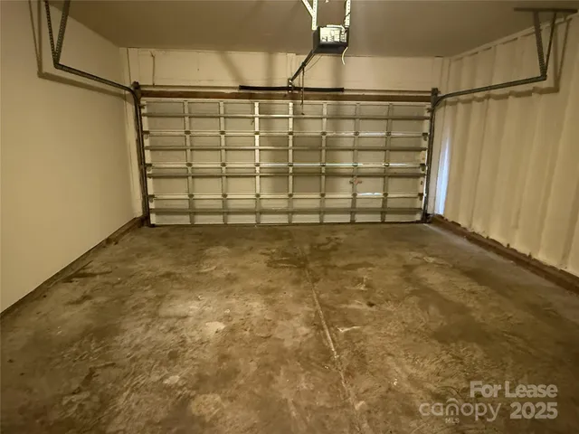 a view of a garage with stairs