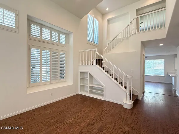 a view of an entryway with wooden floor
