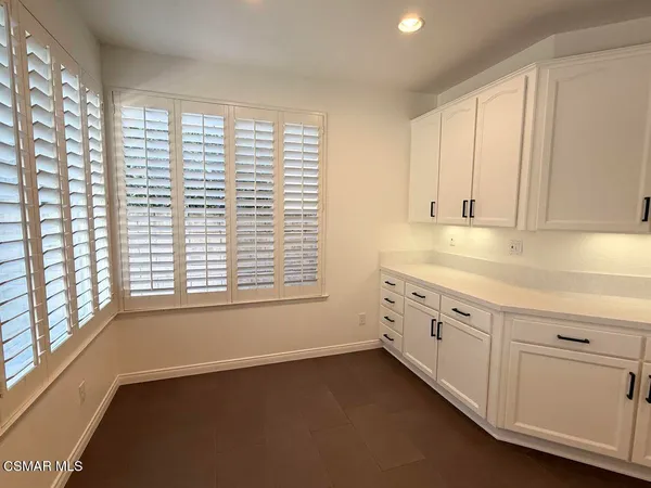 a view of a kitchen with dishwasher and a window