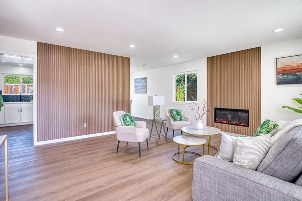a kitchen with sink cabinets and wooden floor