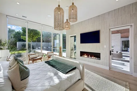 a living room with furniture fireplace and flat screen tv