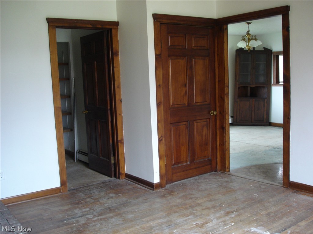 9733 Madison Road Montville, OH 44064 - Photo 28 of 31 View from family room into dining room. Door to left is 1st floor full bath, right is to the basement.