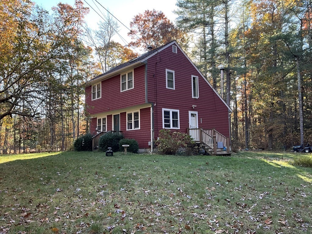 51 Cushman Road Rochester, MA 02770 - Photo 1 of 2 a view of a house with a yard