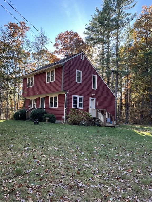 51 Cushman Road Rochester, MA 02770 - Photo 2 of 2 a view of a yard in front of a house