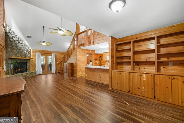a kitchen with a stove a counter top space and cabinets