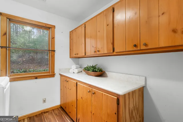 a bathroom with a sink a toilet and a large mirror