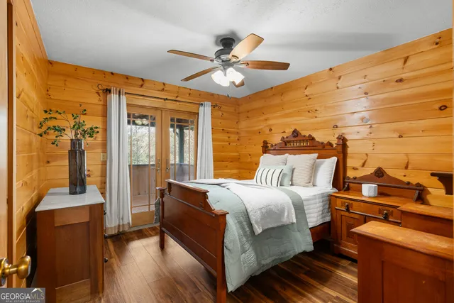 a roof deck with table and chairs and wooden floor