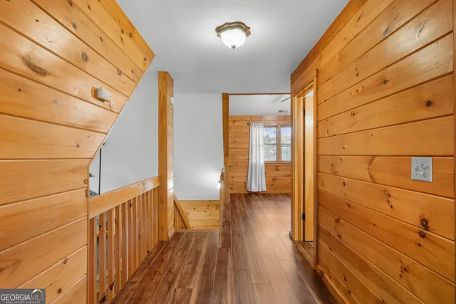 a living room with couch table and a table with wooden floor
