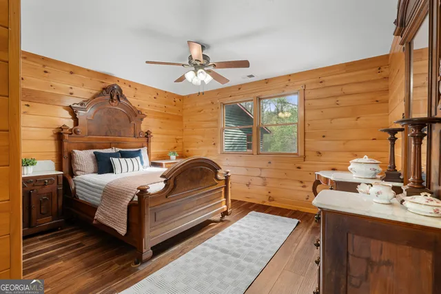 a living room with furniture fireplace and wooden floor